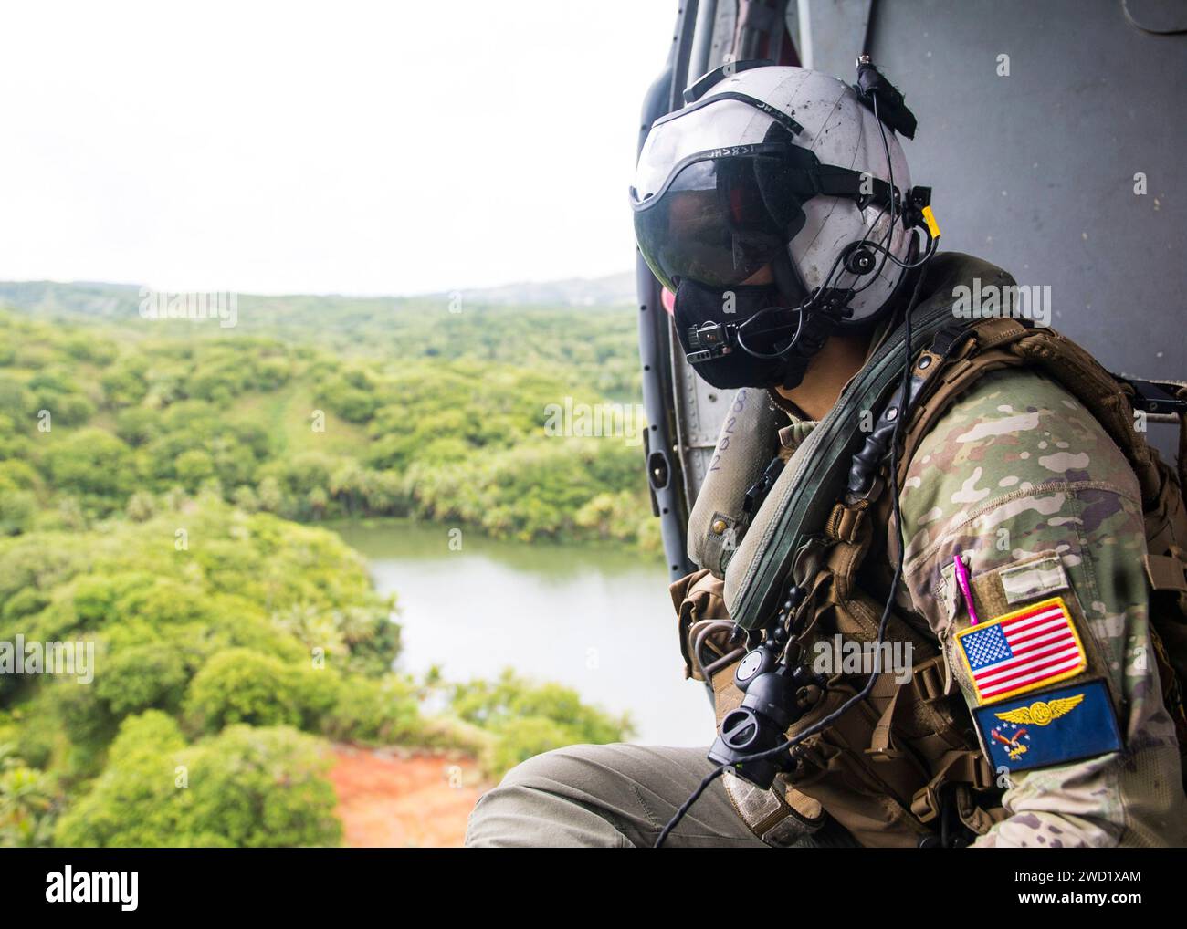 Naval Aircrewman rides in an MH-60S Sea Hawk helicopter. Stock Photo