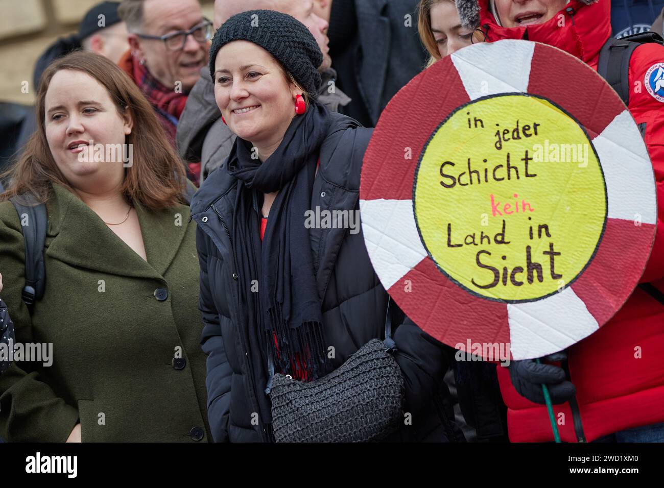 Berlin, Germany. 18th Jan, 2024. Ricarda Lang (l, Bündnis90/Die Grünen), Federal Chairwoman, and Janine Wissler (Die Linke), Federal Chairwoman, take part in a demonstration in front of the House of Representatives with employees of the Jewish Hospital Berlin (JKB) and stand next to a placard reading 'no land in sight on any shift'. Since last week, JKB employees have been on indefinite strike for more staff. Credit: Jörg Carstensen/dpa/Alamy Live News Stock Photo