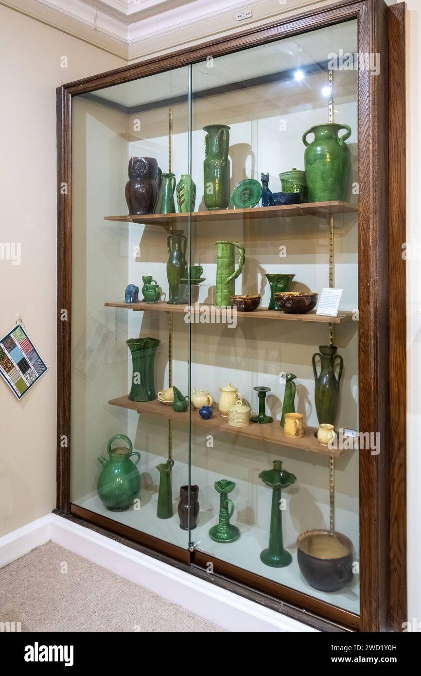 Museum of Farnham interior with exhibits about local history, a visitor attraction in Farnham, Surrey, England, UK. Farnham pottery in display case. Stock Photo