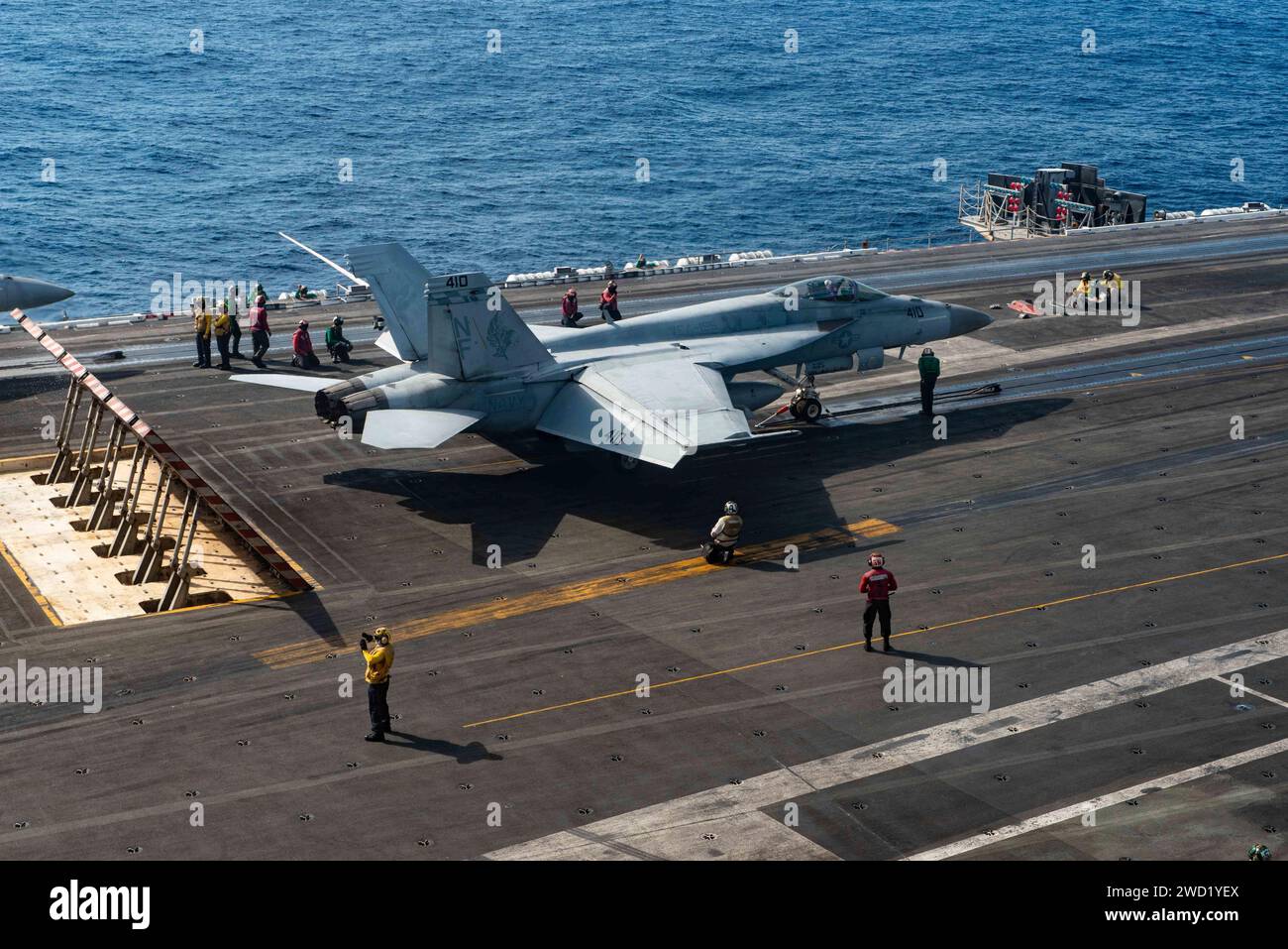 An F/A-18E Super Hornet prepares to take off from the flight deck of USS Ronald Reagan. Stock Photo