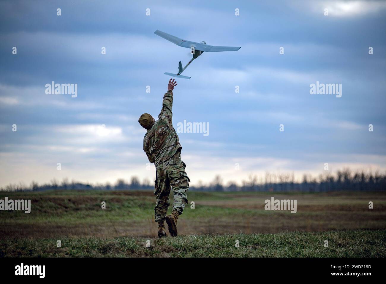 U.S. Army Soldier launches the RQ-11 Raven at Fort Campbell, Kentucky. Stock Photo