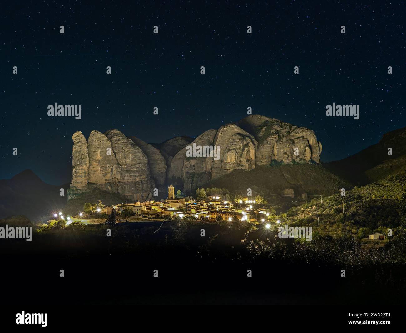 View at the Aguero village with Mallos de Aguero rock formations - Spain Stock Photo
