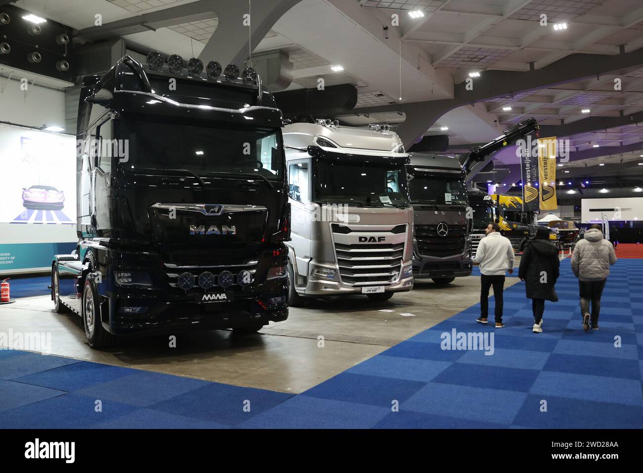 Brussels, Belgium. 17th Jan, 2024. Visitors view trucks displayed at Brussels Auto Show in Brussels, Belgium, Jan. 17, 2024. This year's Brussels Auto Show (BAS) kicked off on Wednesday in the Belgian capital, presenting over 400 cars, motorcycles, and trucks from more than 150 companies, putting sustainable mobility in the limelight. Credit: Zhao Dingzhe/Xinhua/Alamy Live News Stock Photo
