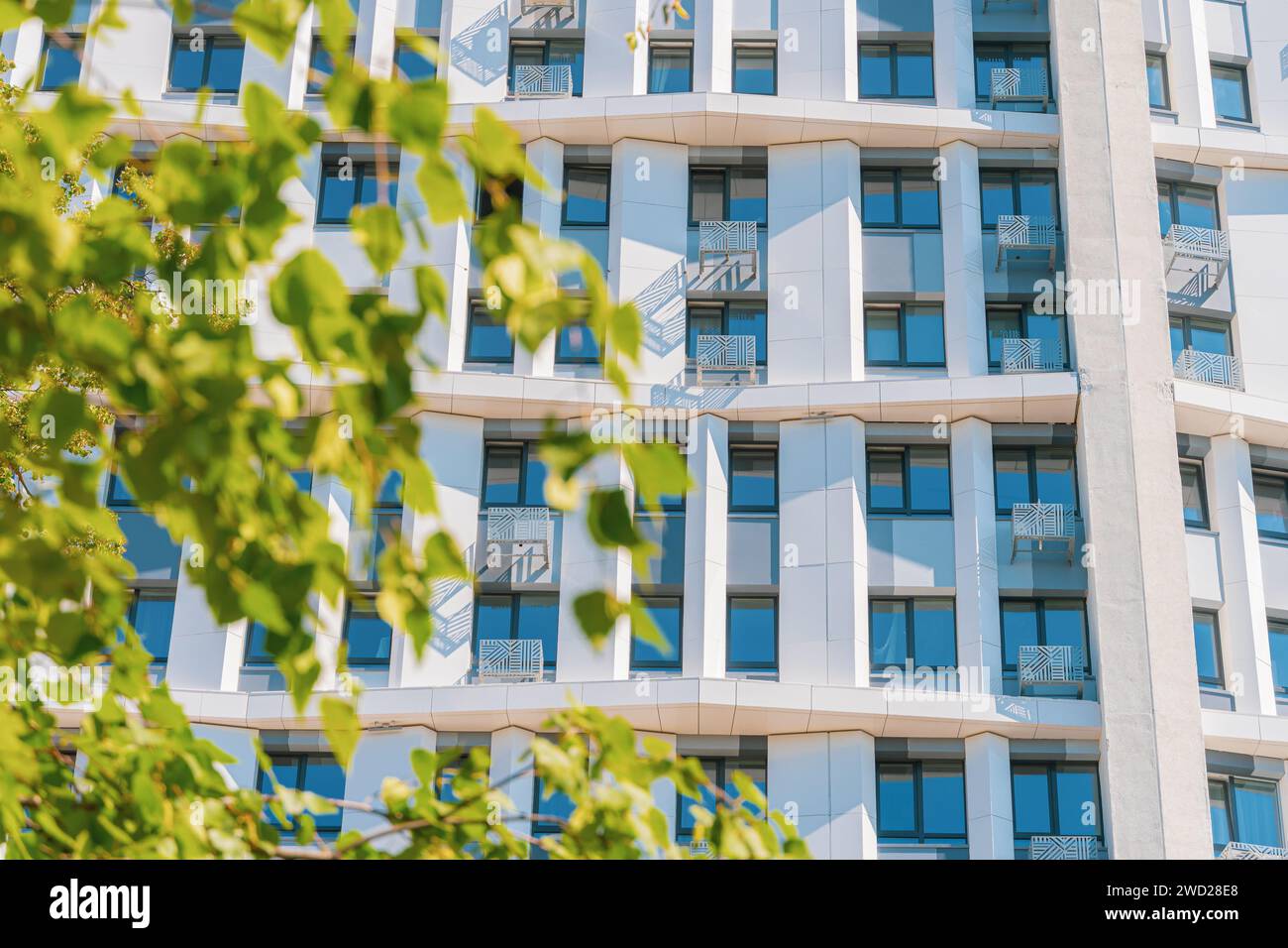 New building facade in housing complex. Modern style in architecture ...