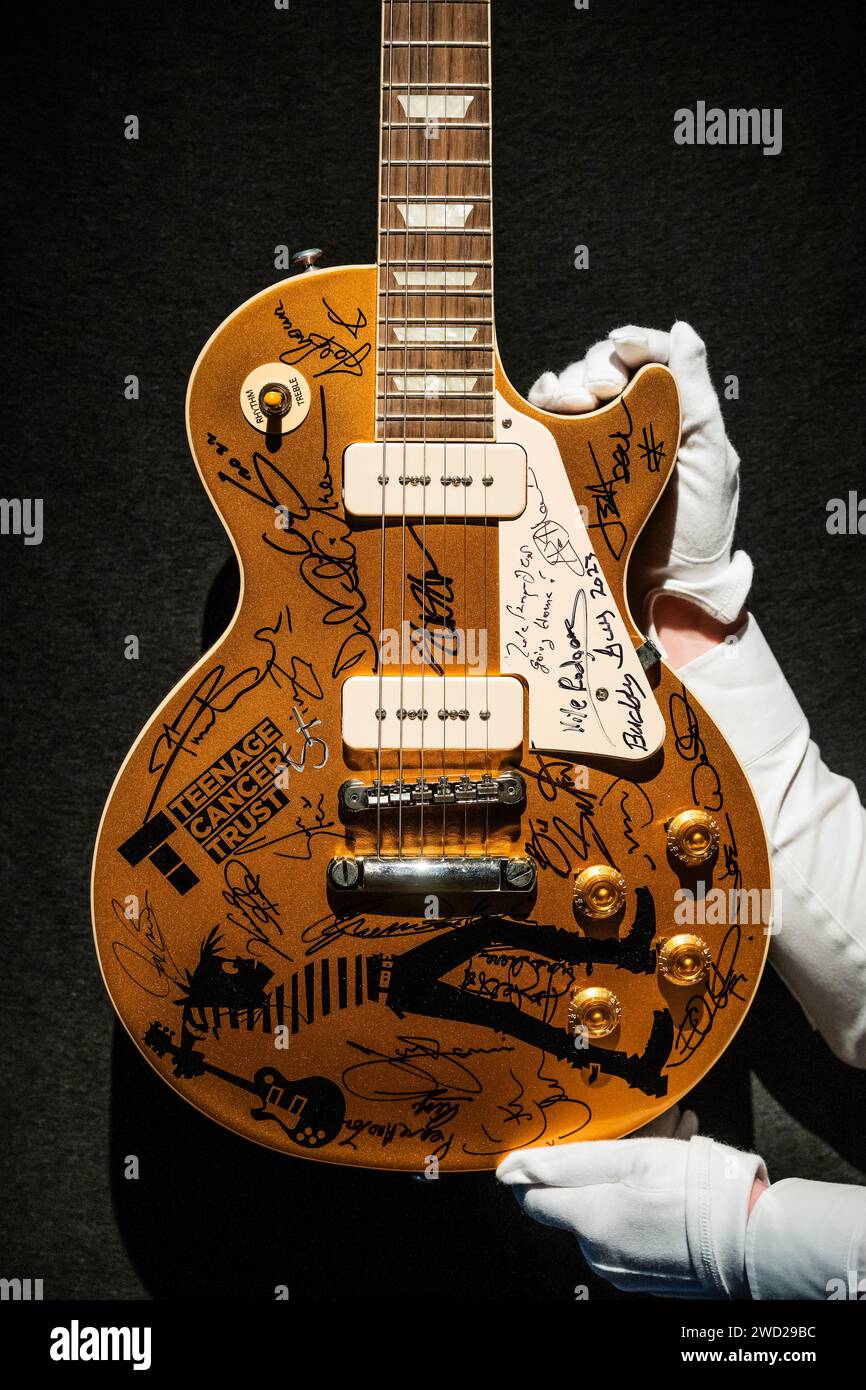 London, UK. 18 Jan 2024. Gibson inlaid at the headstock and silkscreened Les Paul/MODEL, with a Teenage Cancer Trust (all proceeds go to the charity) at the Royal Albert Hall logo and signed on the body, pickguard and headstock by Mark Knopfler, Eric Clapton, Jeff Beck, David Gilmour, Pete Townshend, Roger Daltrey, and many others, est £20,000-40,000 - A preview of The Mark Knopfler Collection at Christies in London. With more than 120 guitars and amps, the collection spans his 50-year career. The sale takes place on 31 January. Other signatories - Hank Marvin, Slash, Ronnie Wood, Brian May Stock Photo