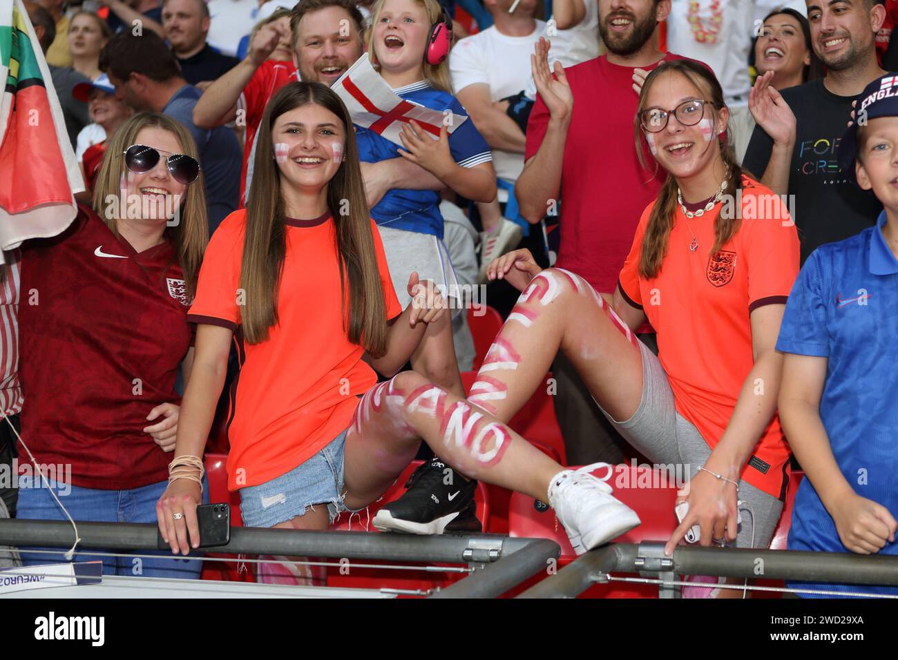 Fans with face paint/ legs painted celebrate after England win UEFA Women's Euro Final 2022 England v Germany at Wembley Stadium, London 31 July 2022 Stock Photo