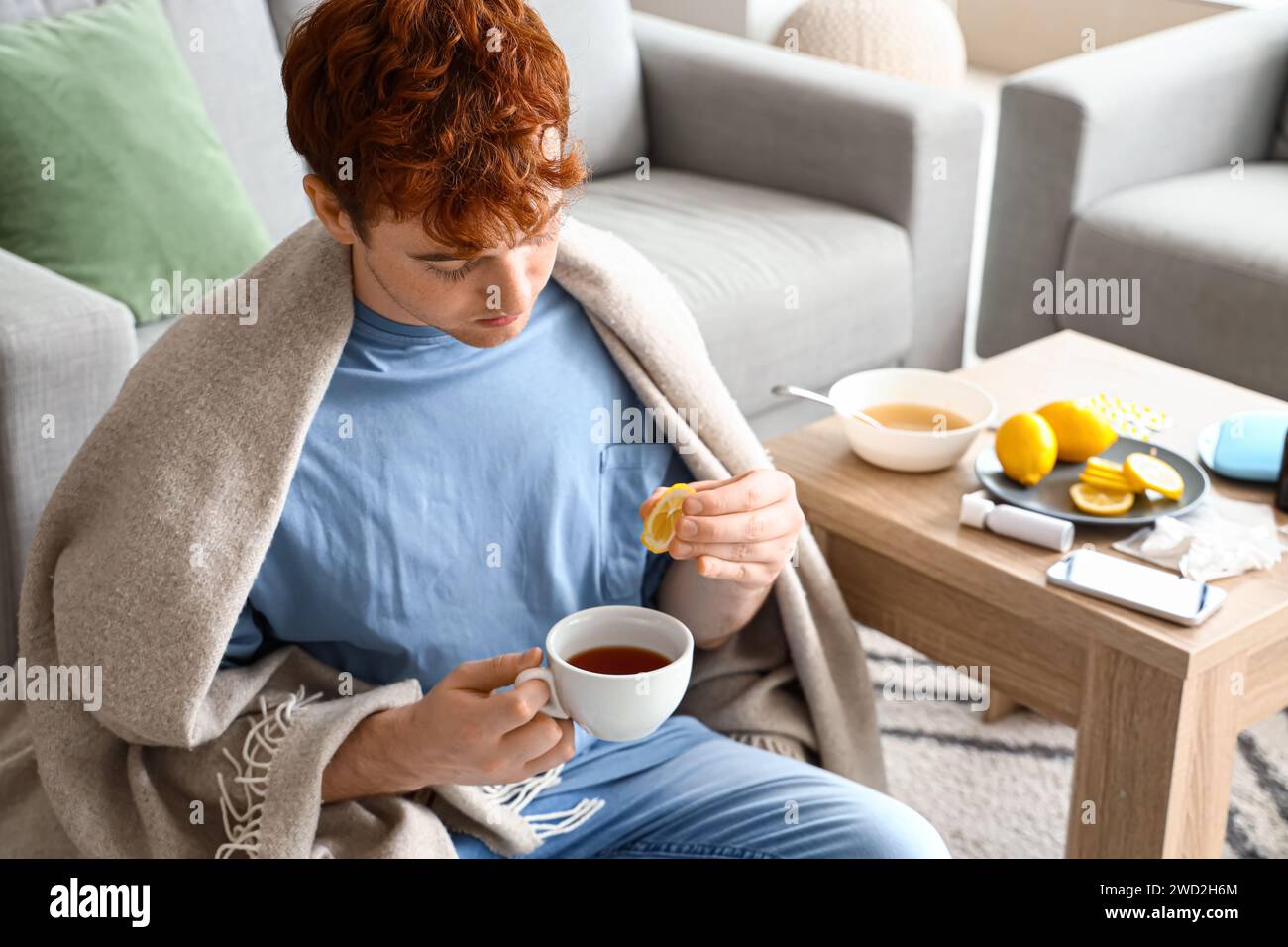 Young man drinking vitamin tea hi-res stock photography and images - Alamy