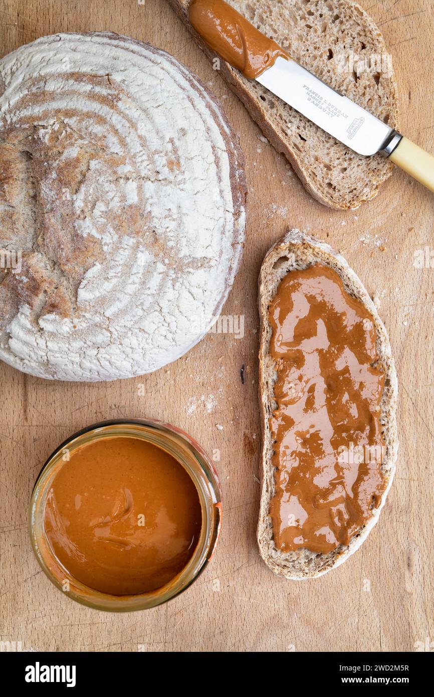 Smooth peanut butter on Sourdough bread Stock Photo Alamy
