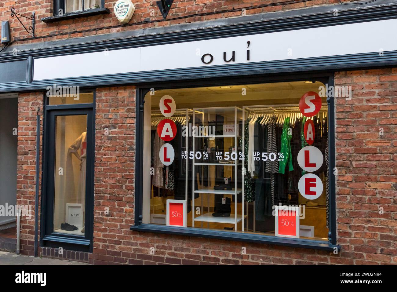 Sale signs in oui ladies clothing shop window, Gordon Road, Bailgate, Lincoln City, Lincolnshire, England, UK Stock Photo