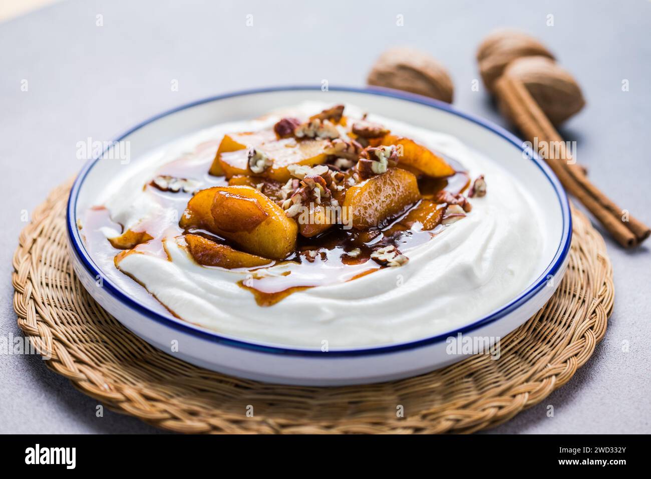 Labneh yogurt cream cheese with roasted apples, copy space. Traditional