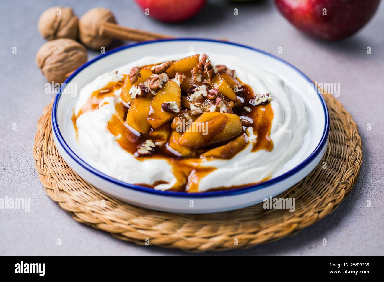Labneh yogurt cream cheese with roasted apples, copy space. Traditional