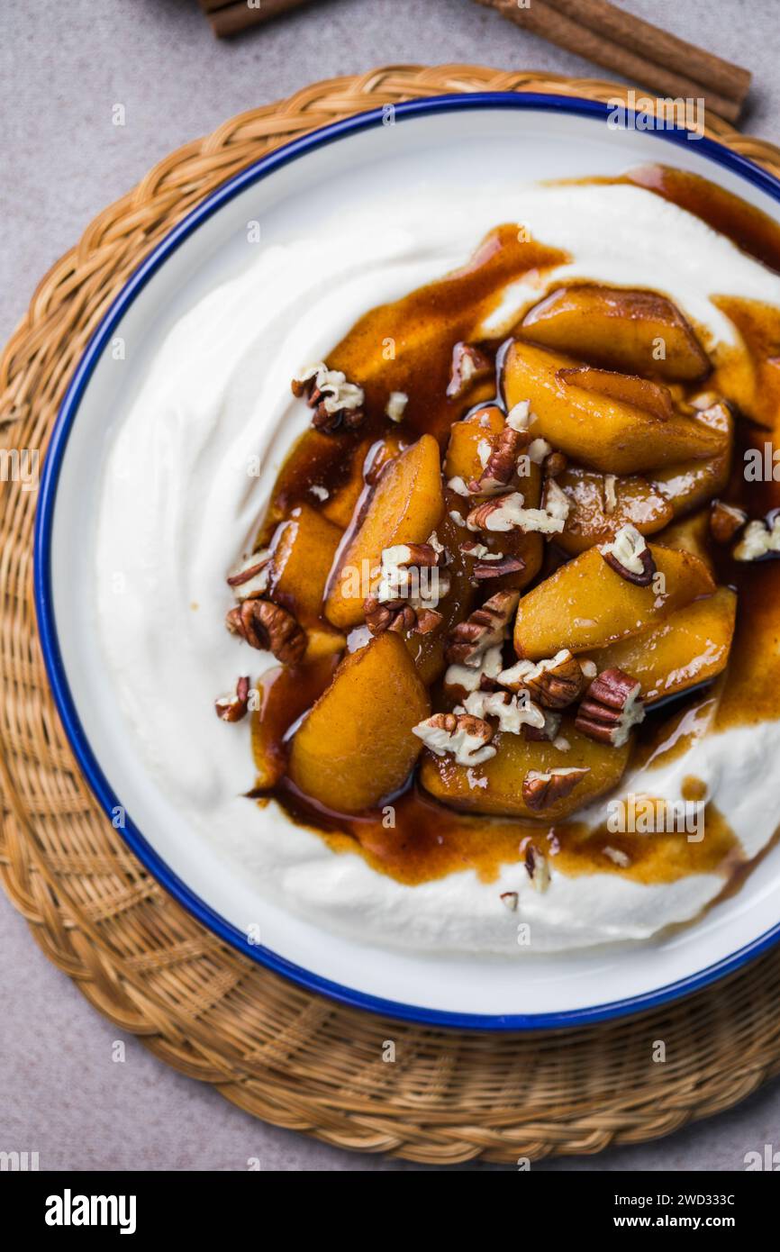 Labneh yogurt cream cheese with roasted apples, copy space. Traditional