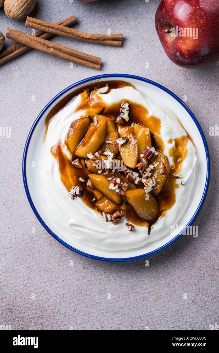 Labneh yogurt cream cheese with roasted apples, copy space. Traditional