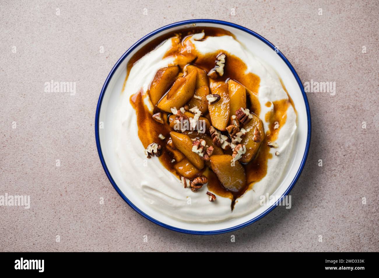 Labneh yogurt cream cheese with roasted apples, copy space. Traditional