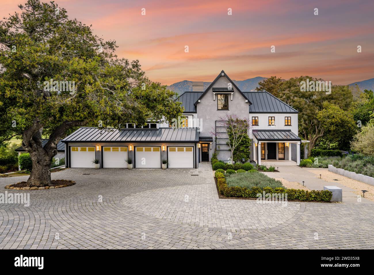 Spacious Trees Spacious hilltop estate with tree and driveway Stock Photo - Alamy