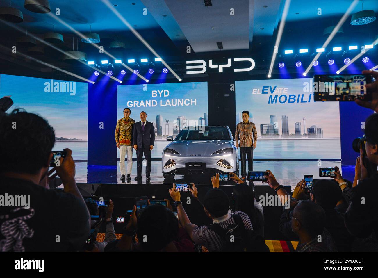 Jakarta, Indonesia. 18th Jan, 2024. Guests pose for photos with a BYD ...
