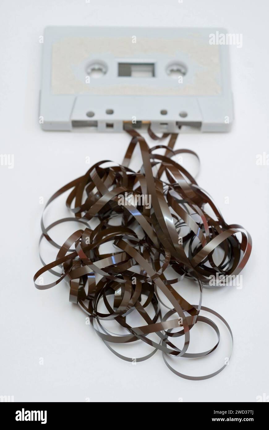 tangled tape outside an old audio cassette Stock Photo