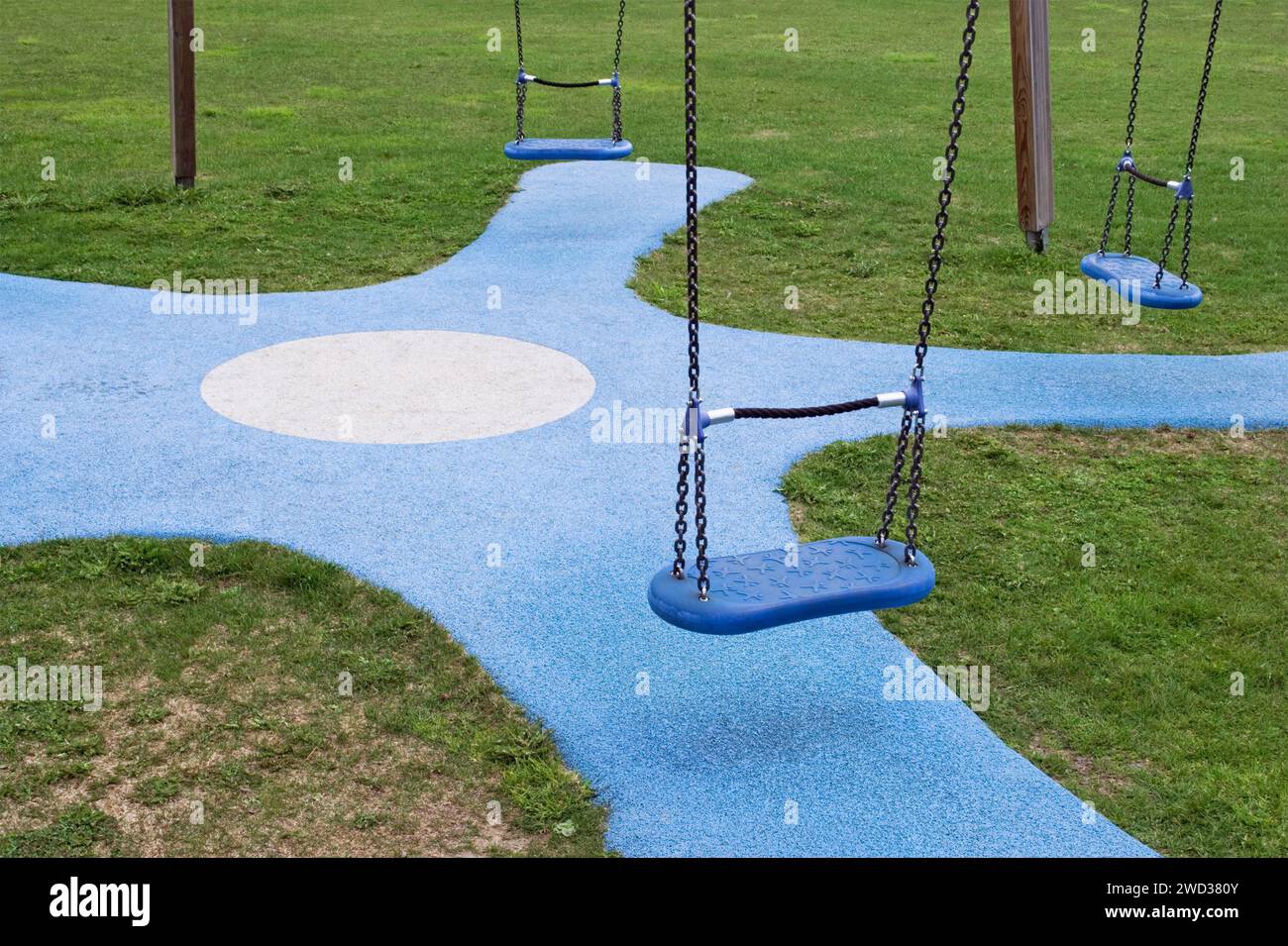 swings in playground Stock Photo