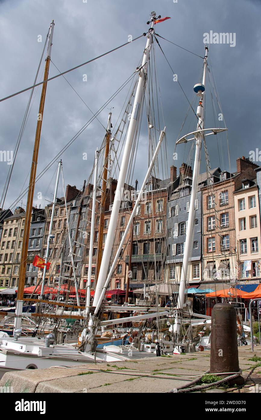 Honfleur, harbor basin with half-timbered houses and fishing boats Stock Photo