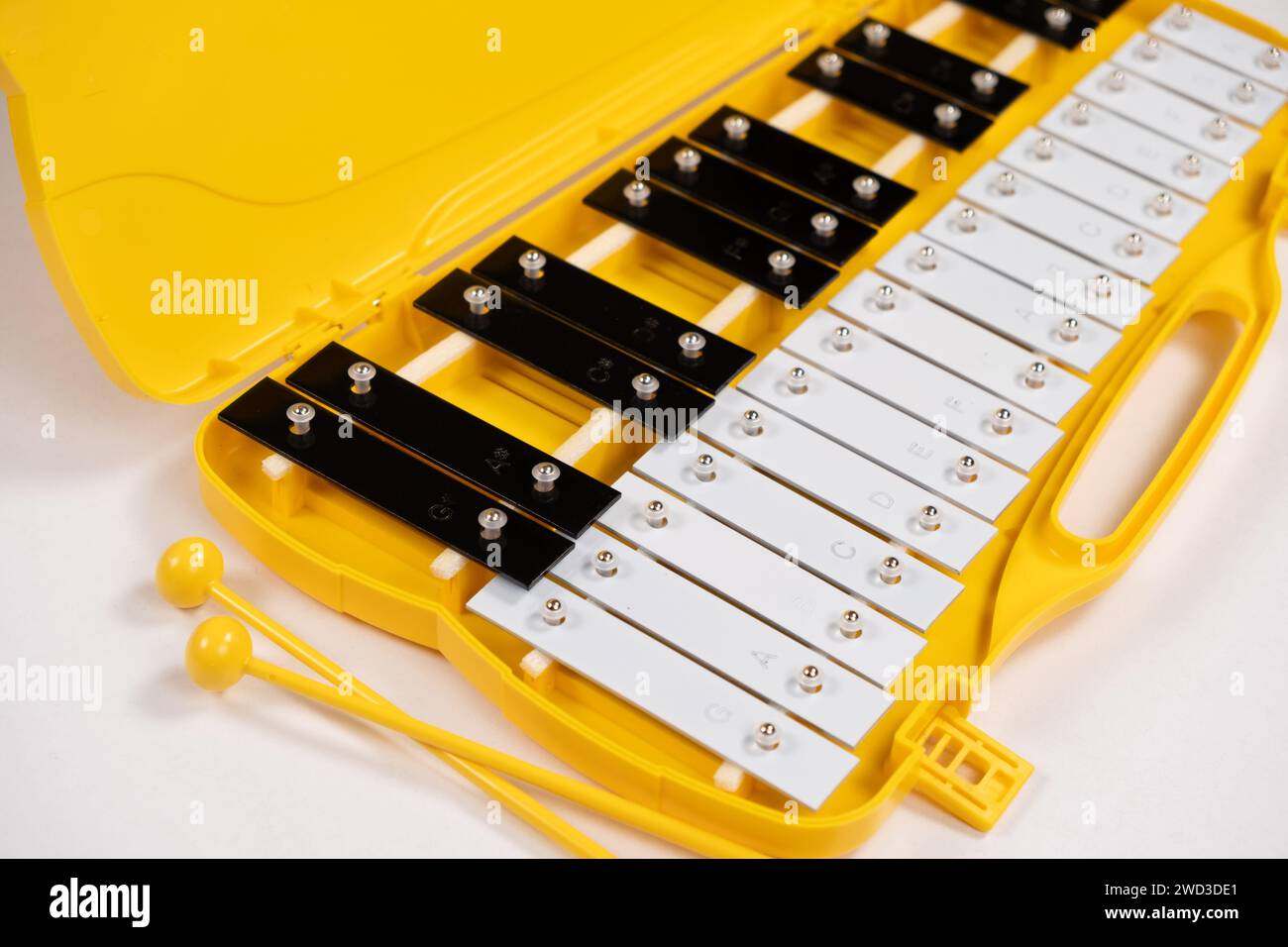 Metallophone, metal xylophone, percussion musical instrument on a white