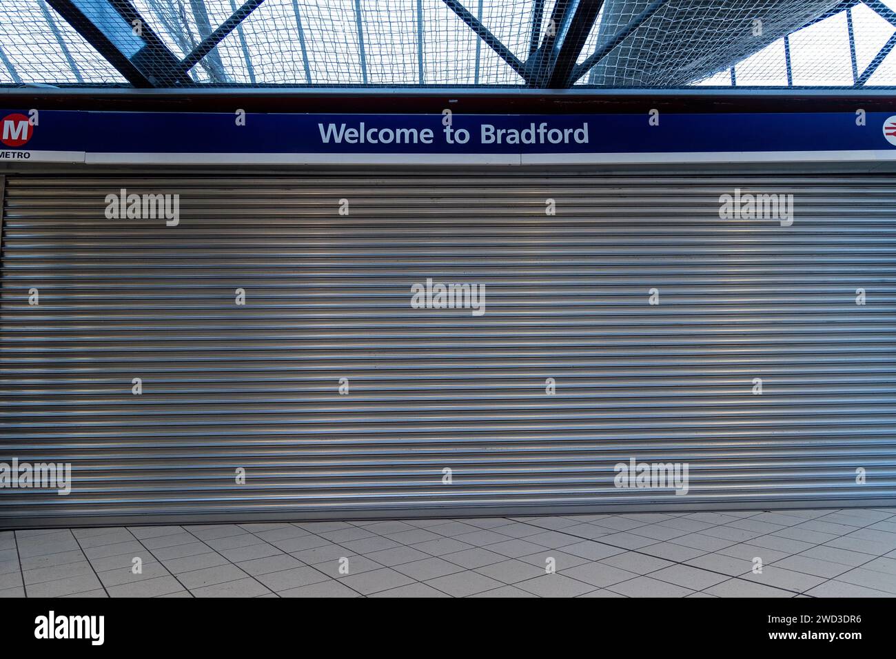 Bradford, UK, 18 January 2024, Bradford Interchange bus station remains closed following reports of damage on 04.01.2024. Welcome to Bradford reads the sign as passengers arrive into Bradford to see shutters indicating the city is closed. Credit: Neil Terry/ Neil Terry Photography Stock Photo