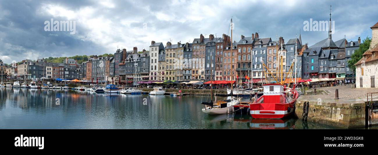 Honfleur, harbor basin with half-timbered houses and fishing boats, panorama Stock Photo