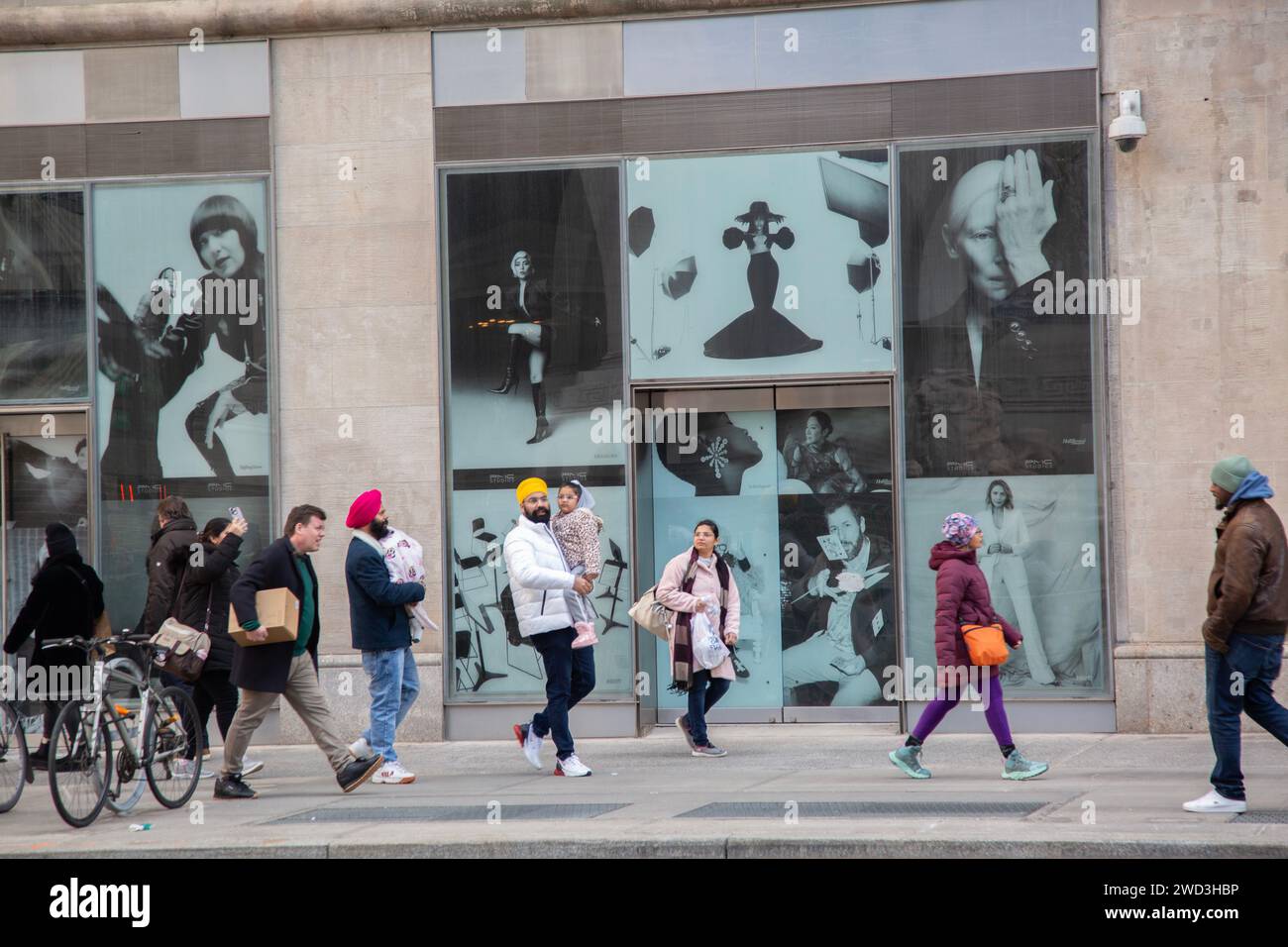 People walk along 5th Avenue in midtown Manhattan, New York City. Stock Photo