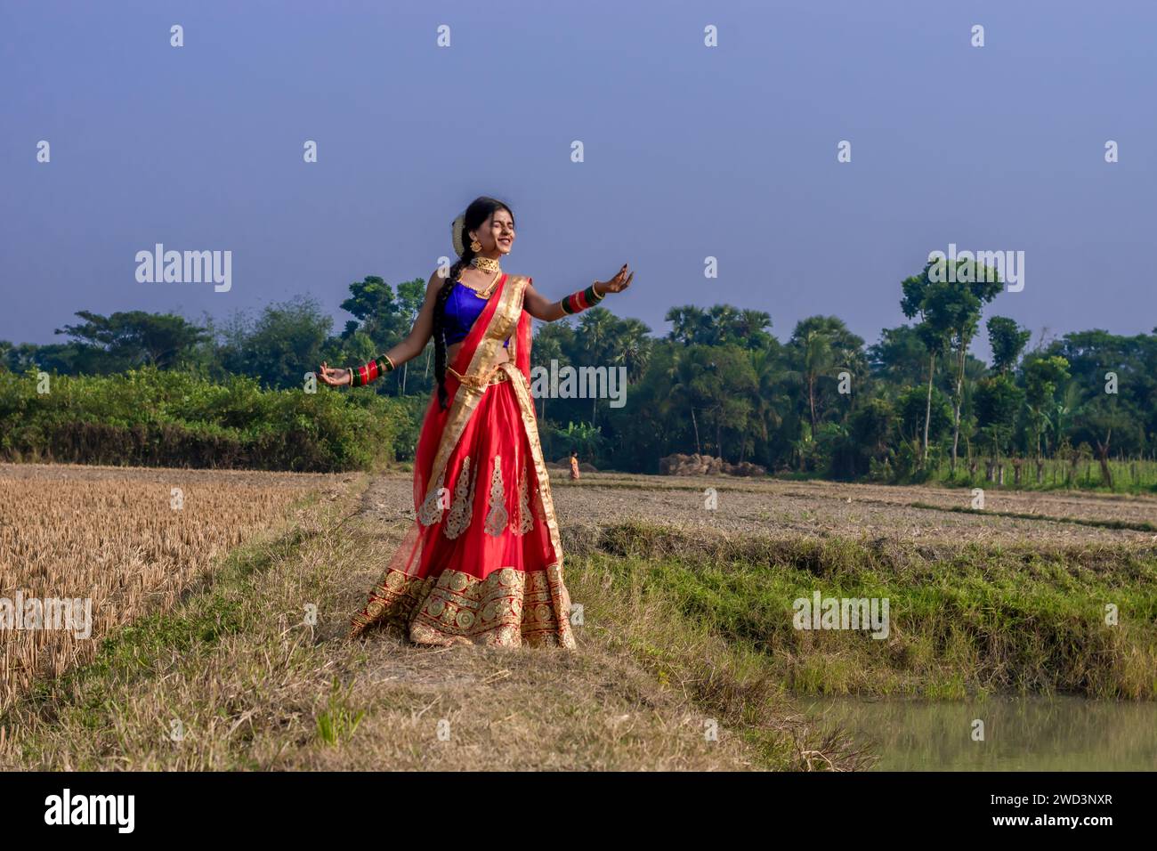 Indian rural girl smiling and enjoying nature. Freedom concept. Stock Photo