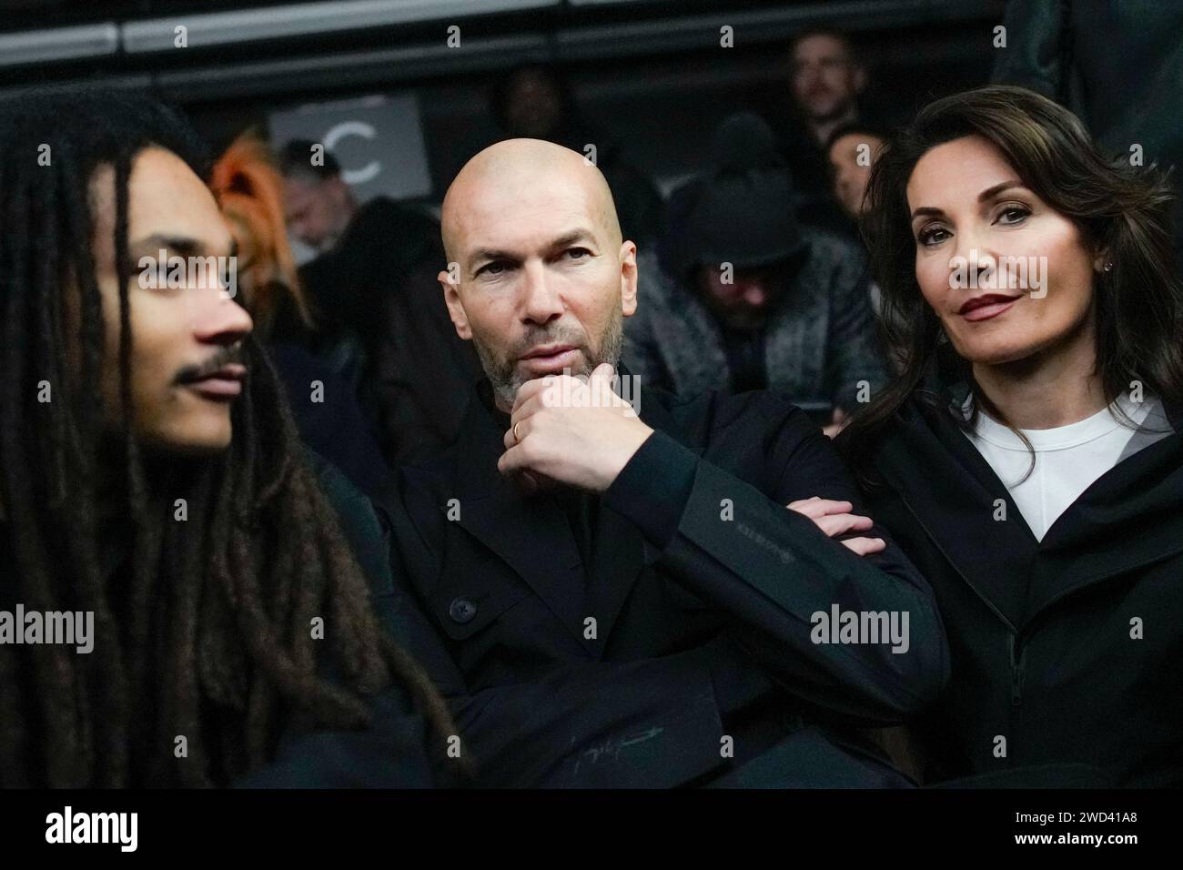 Zinedine Zidane, center, and Veronique Zidane, right, attend Yohji