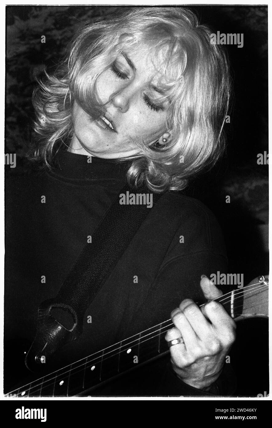 CATATONIA, CONCERT, 1994: A very young Cerys Matthews  of Catatonia playing live at the Legendary TJ’s in Newport, Wales, UK on 9 April 1994. Photo: Rob Watkins. INFO: Catatonia, a Welsh alternative rock band in the '90s, fronted by Cerys Matthews, gained fame with hits like 'Mulder and Scully' and 'Road Rage.' Their eclectic sound, blending pop, rock, and folk, solidified their place in the Britpop era, showcasing Matthews' distinctive vocals. Stock Photo