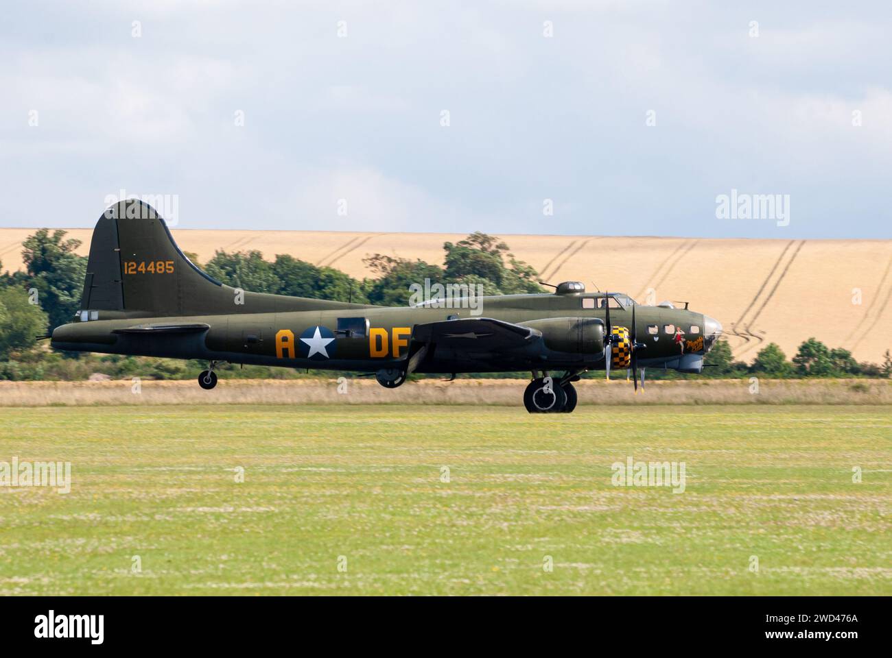 Boeing B-17G Flying Fortress '124485' WW2 Bomber plane representing the famous 'Memphis Belle' landing on grass runway Stock Photo