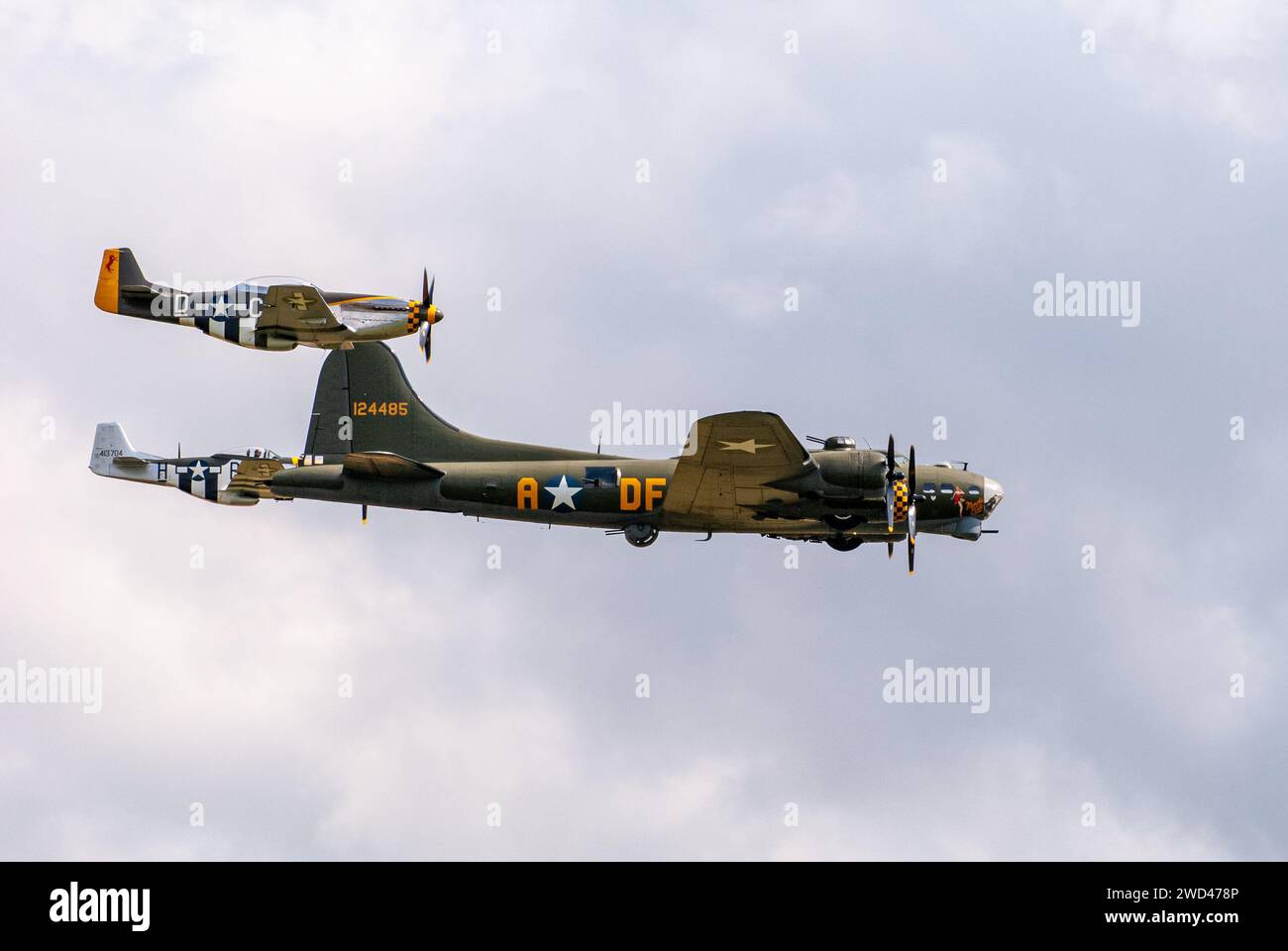 B-17G Flying Fortress with P51 Mustang fighter planes.  WW2 Bomber plane from United States airforce representing the famous 'Memphis Belle' 124485' Stock Photo