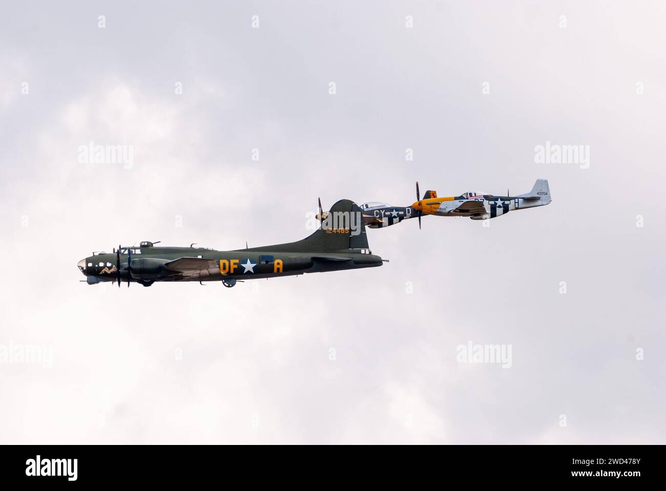 B-17G Flying Fortress with P51 Mustang fighter planes.  WW2 Bomber plane from United States airforce representing the famous 'Memphis Belle' 124485' Stock Photo