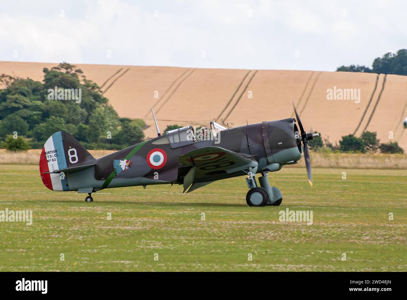 Curtiss P-36 Hawk WW2 fighter plane (tail number 82-ALA) on the runway at Duxford airshow in the United Kingdom. Stock Photo