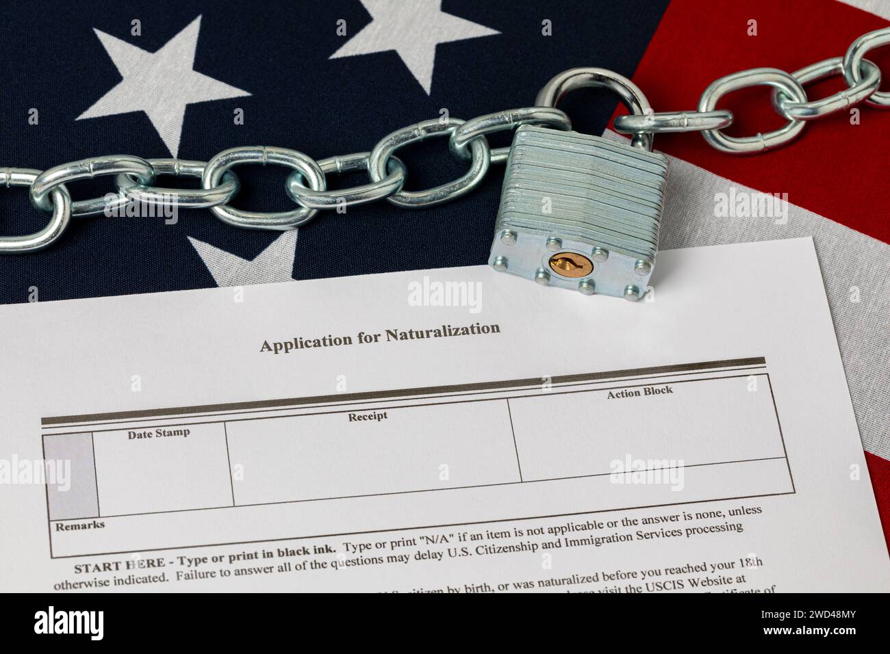 United States flag with unlocked chain. Border security, immigration reform and illegal migrant crisis concept. Stock Photo