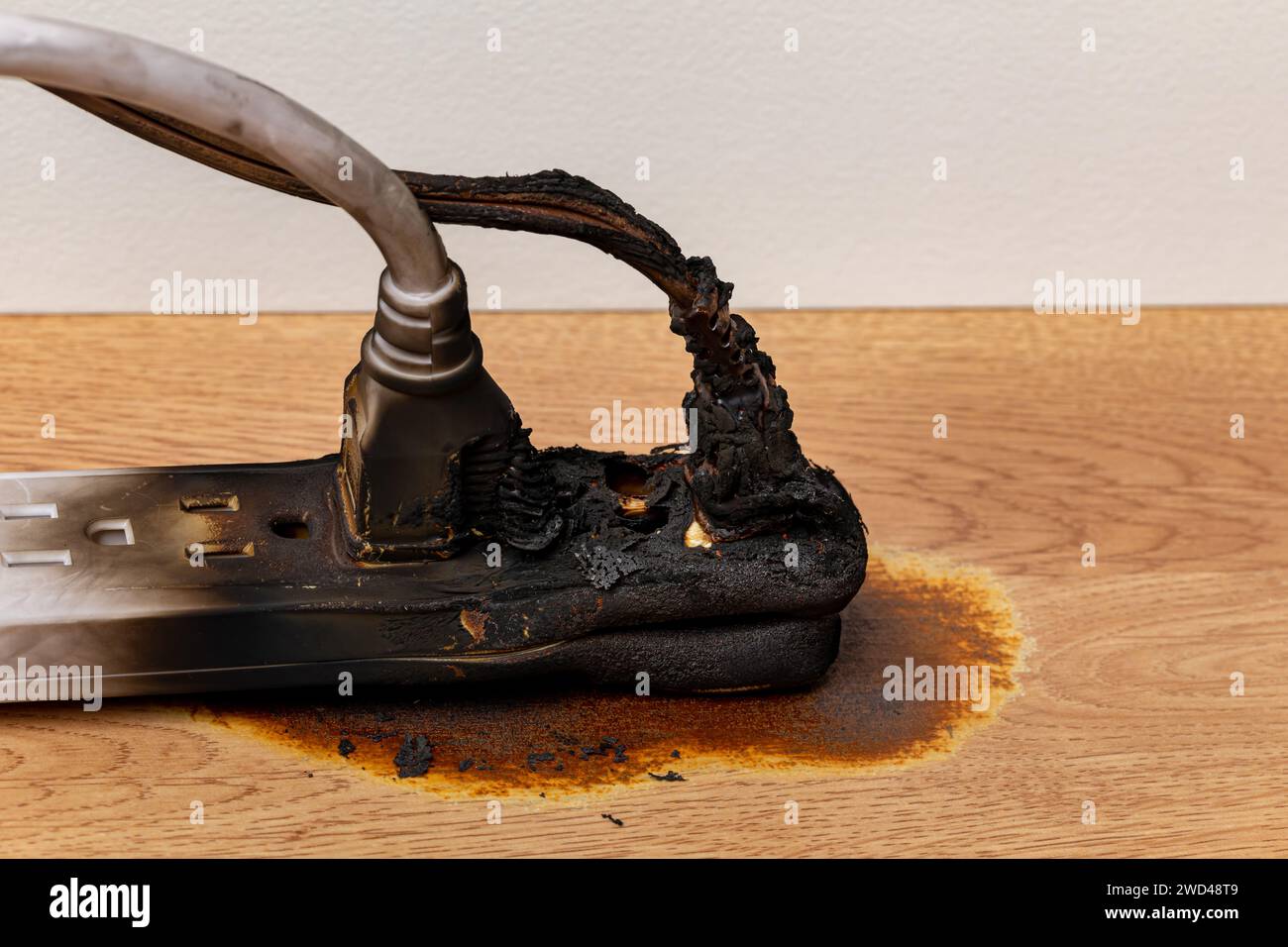 Electrical surge protector outlet and extension cord fire. Electricity