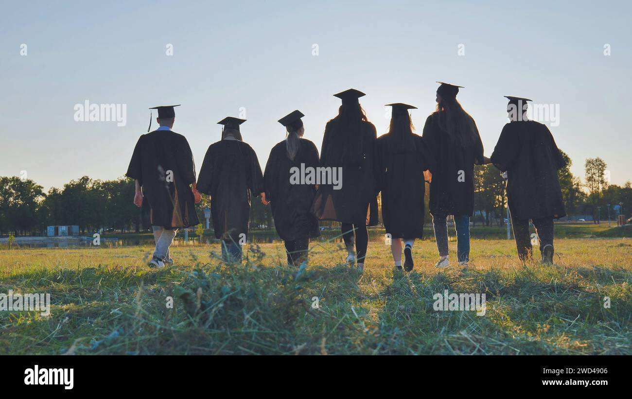 College graduates walk sunset hi-res stock photography and images - Alamy