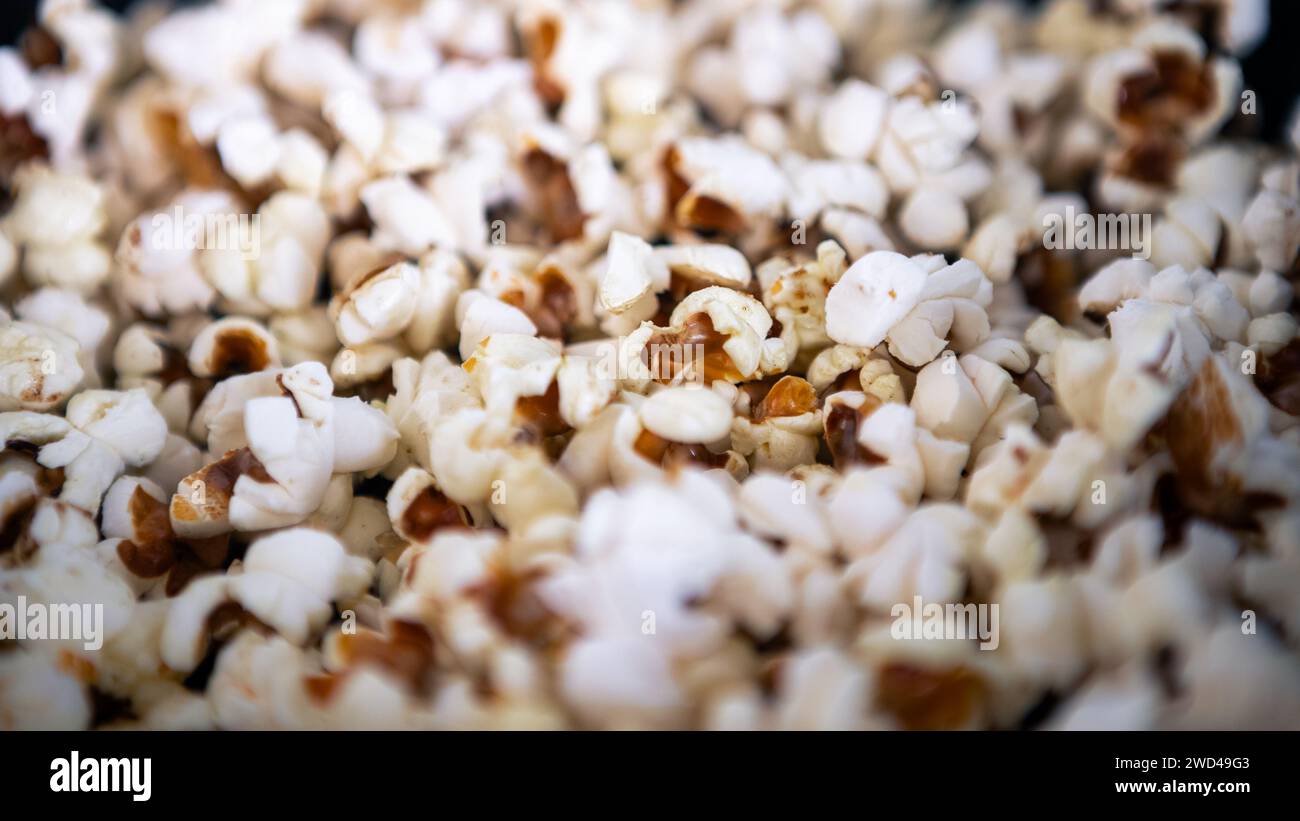 Homemade popcorn popping wildly. Crunchy pop corn snack cooked
