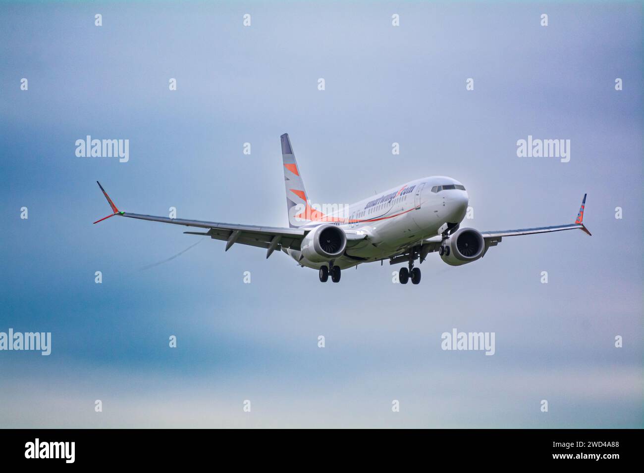 Boeing 737 Max 8 Commercial airline (OK -SWA) operated by smart wings, landing in strong winds and turbulence in Europe. Stock Photo