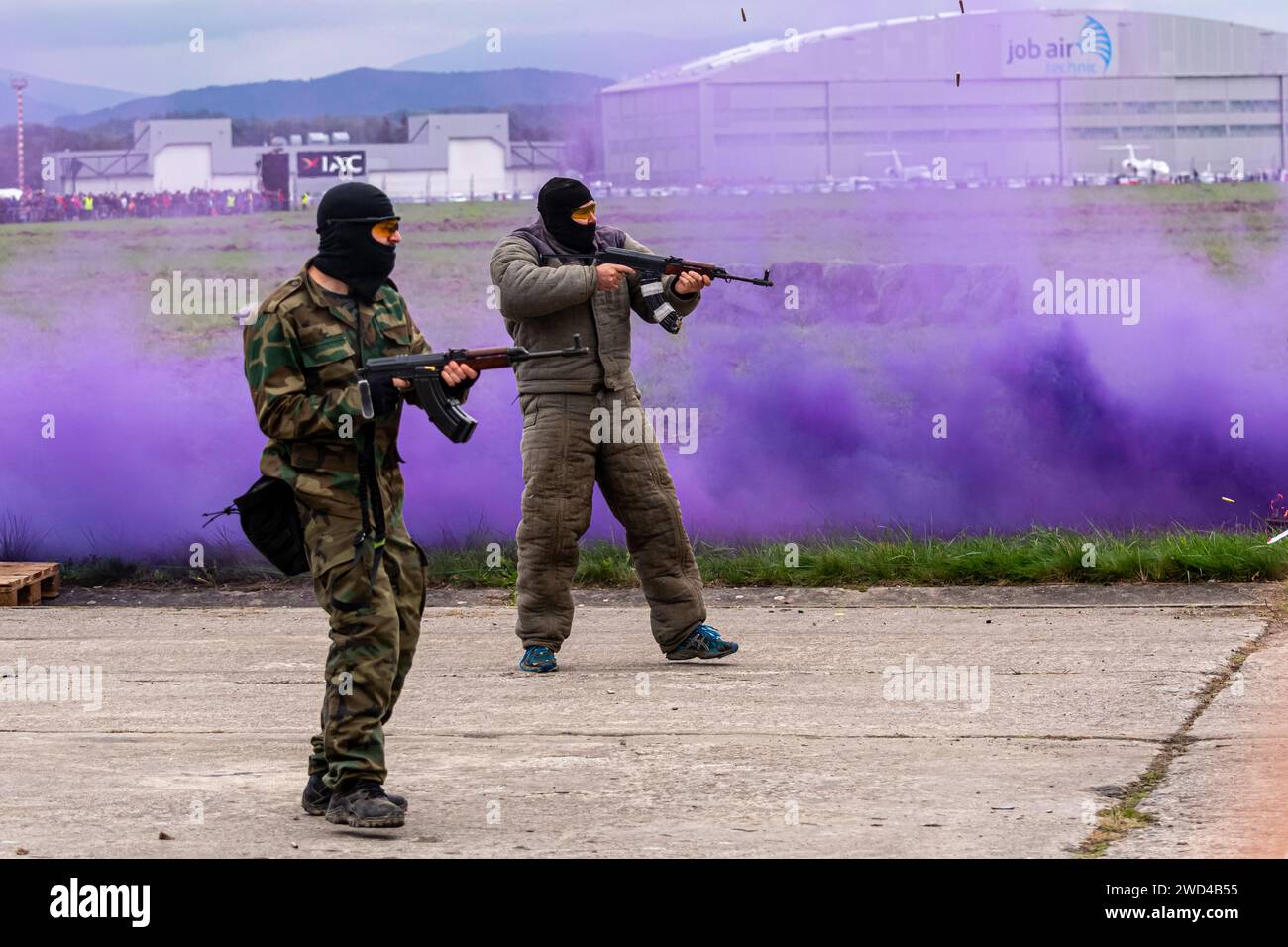 Terrorist insurgents shooting guns during demonstration at Leoš Janáček Airport in the Czech Republic at an airshow re-enactment. Stock Photo