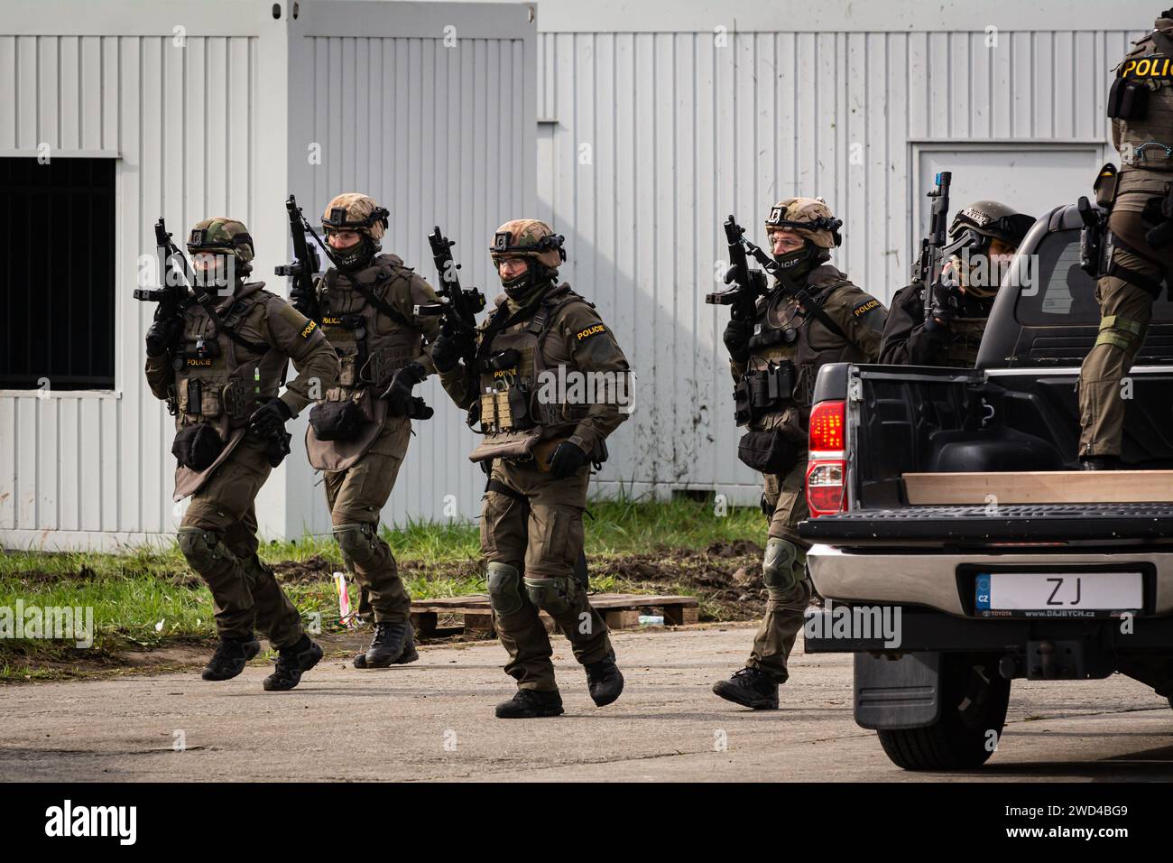 Special forces tactical police operators from the Czech Republic in a hostage negotiation rehearsal at NATO days airshow. Stock Photo