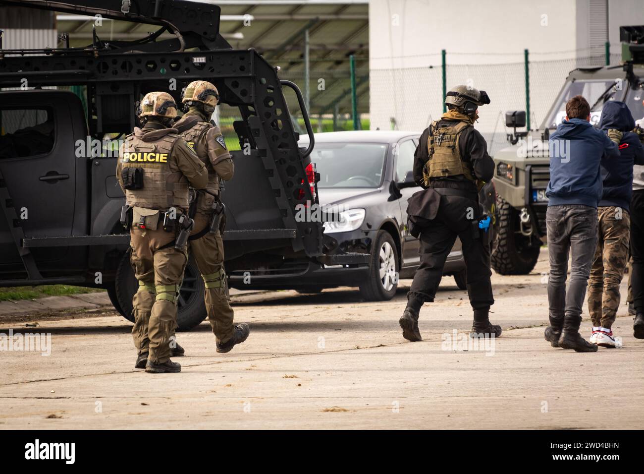 Special forces SWAT police arresting criminals and releasing hostages during demonstration at NATO days airshow. Tactical operators on a mission Stock Photo