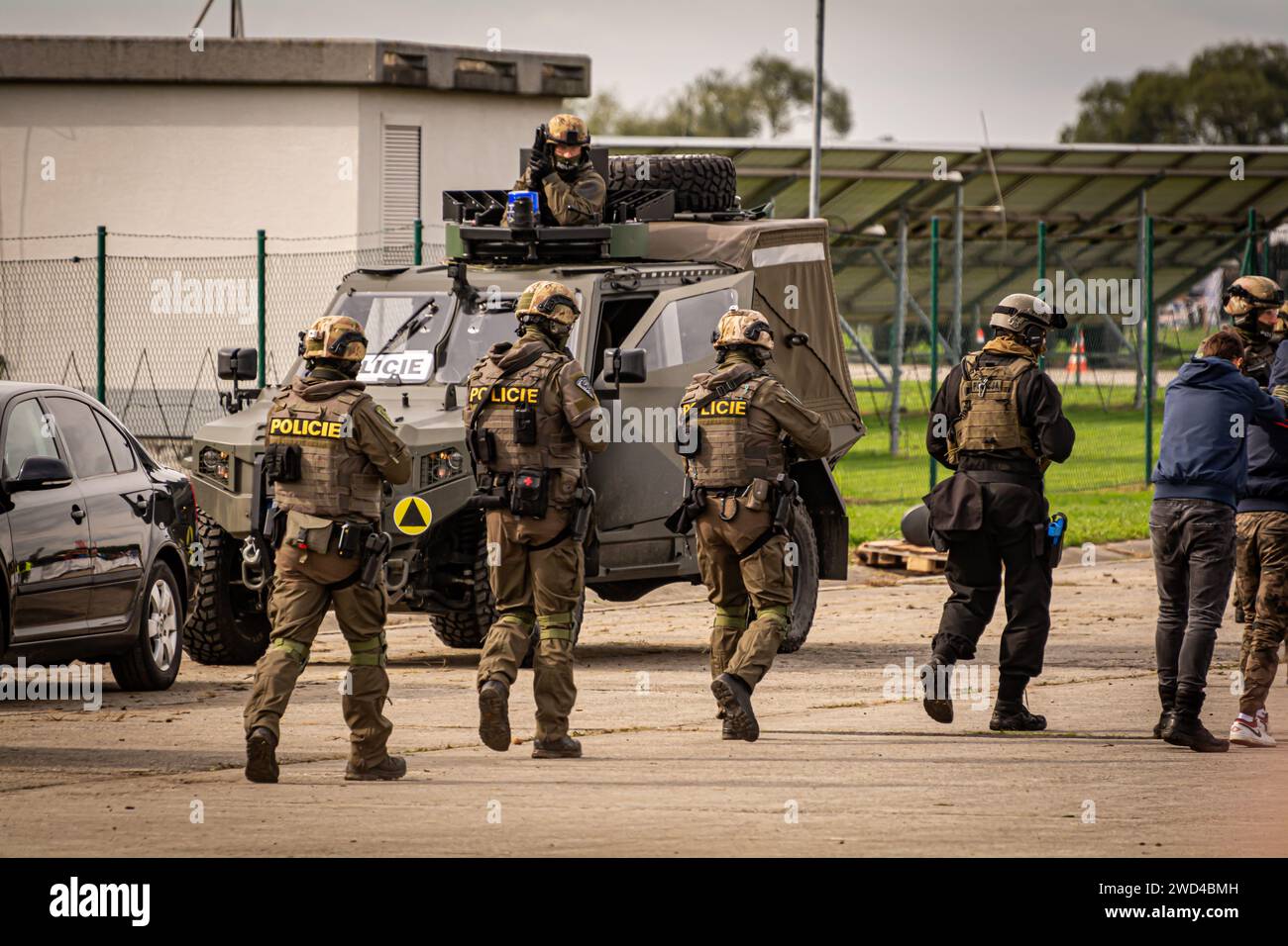 Swat special forces police and tactical units in uniform rescue hostages in a training scenario at NATO days airshow 2022. Soldiers with guns defend. Stock Photo