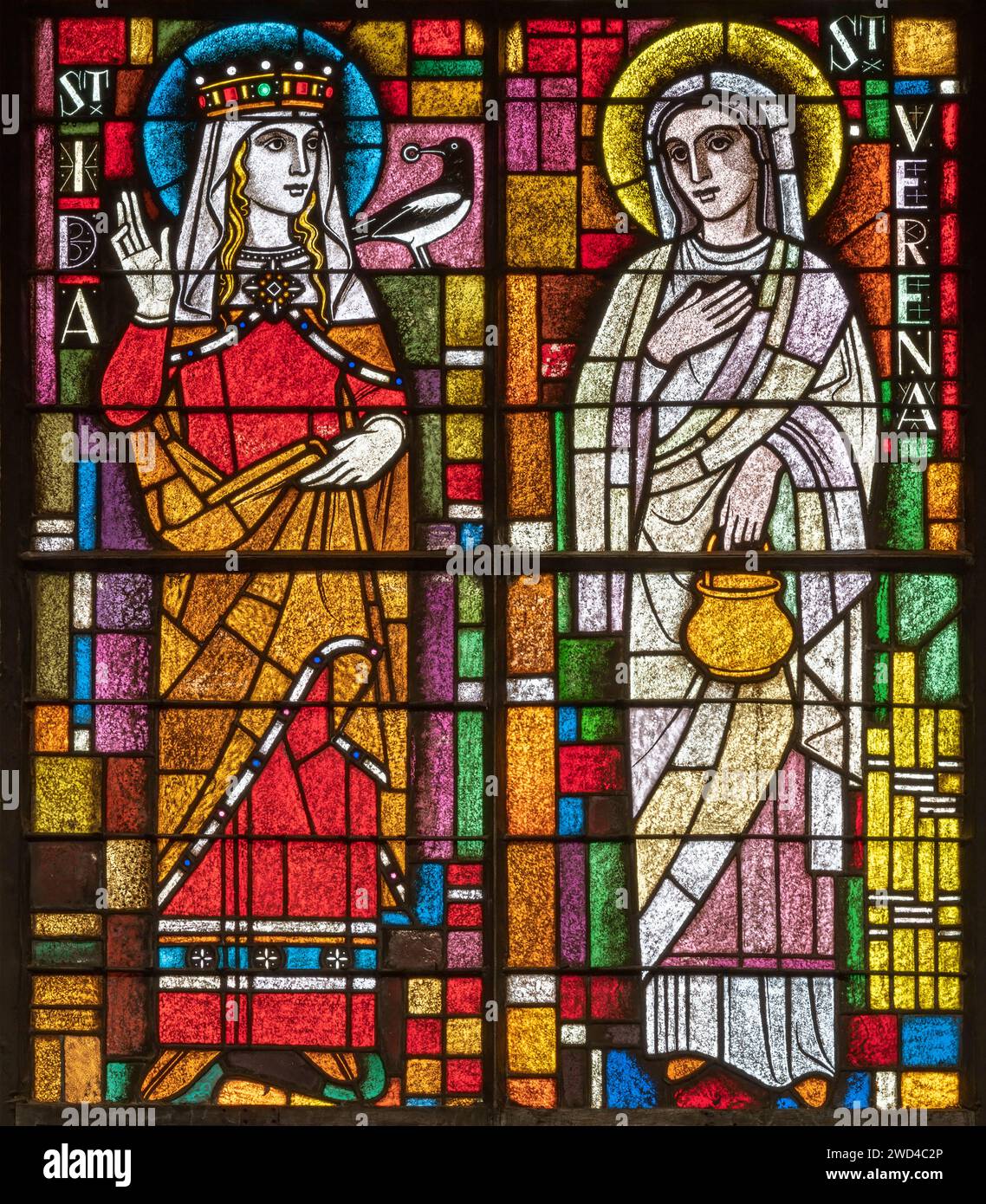 BERN, SWITZERLAND - JUNY 27, 2022: The St. Verena and St. Ida on the stained glass in the church Dreifaltigkeitskirche by A. Schweri (1938). Stock Photo