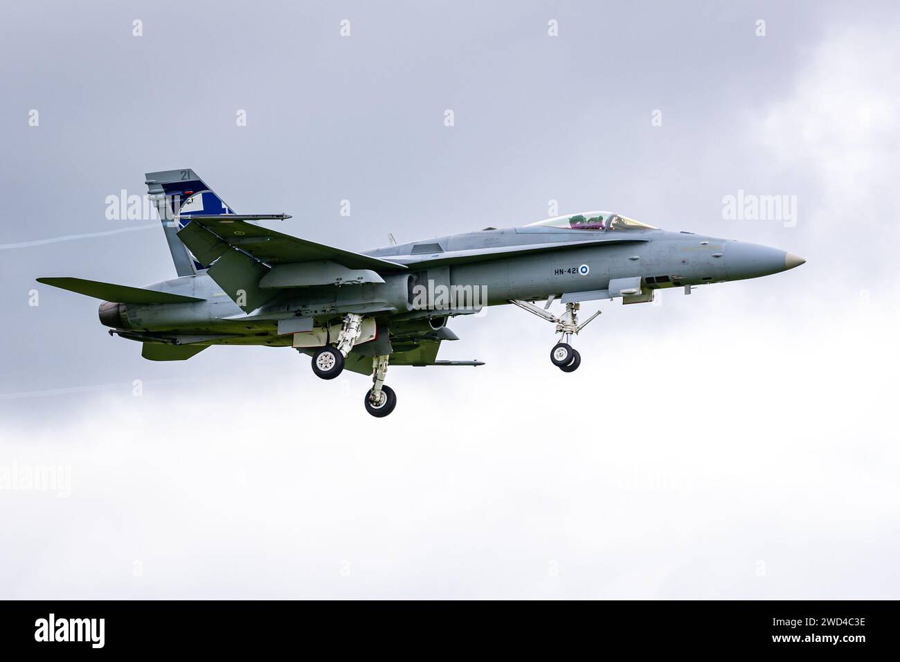 F18 McDonnell Douglas F/A-18C Operated by the Finnish air force - Fighter jet landing on runway with wheels deployed. Stock Photo