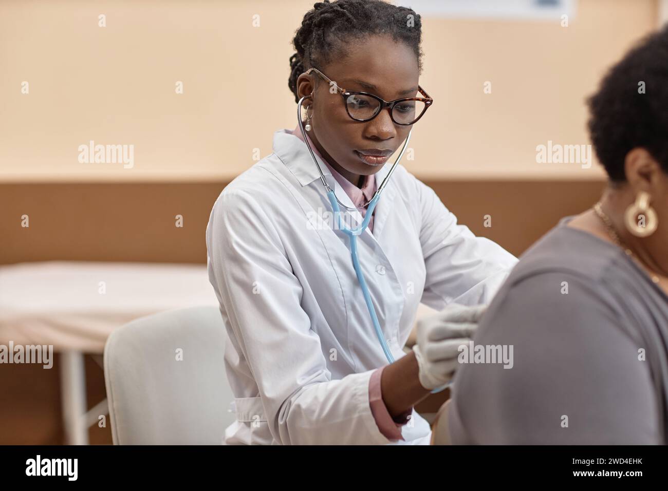 Female Doctor Using Stethoscope Stock Photo