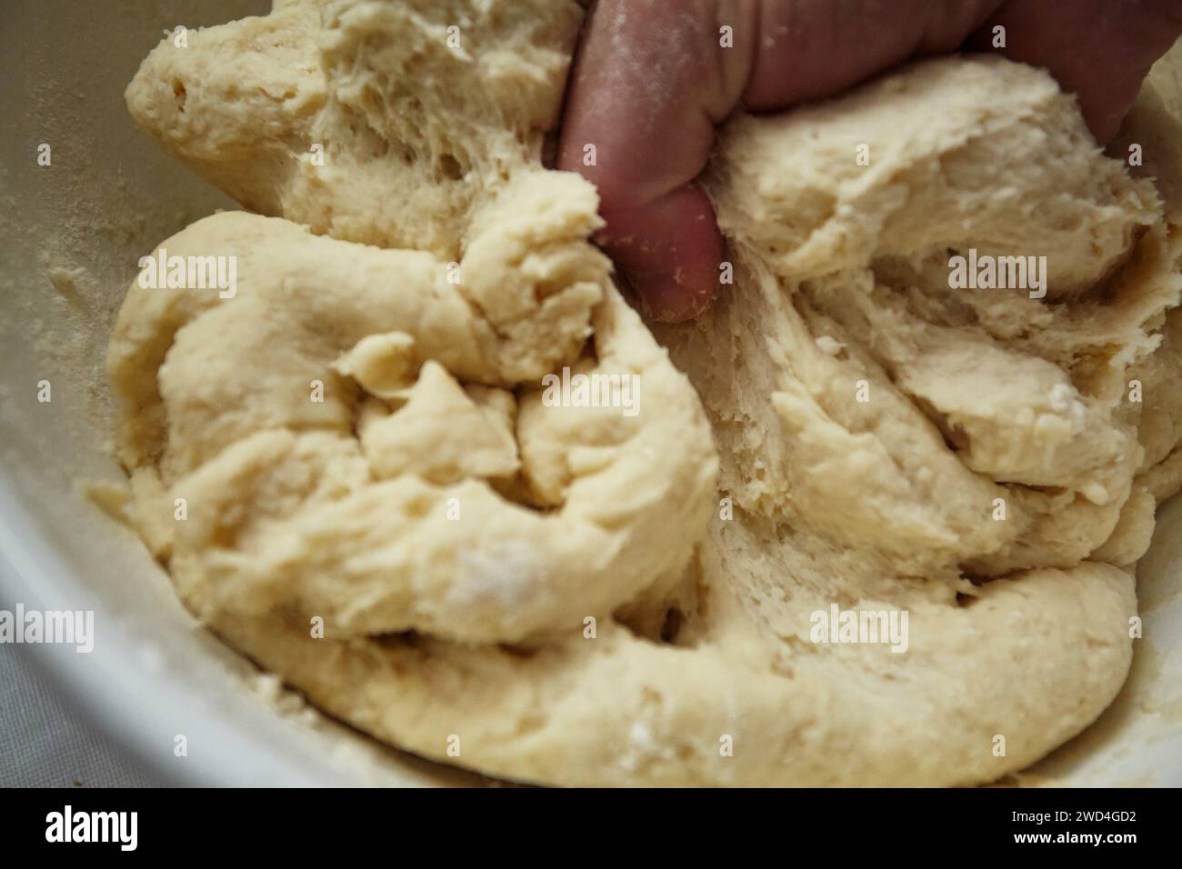 Mixing flour with water.Turning into a dough for the preparation of