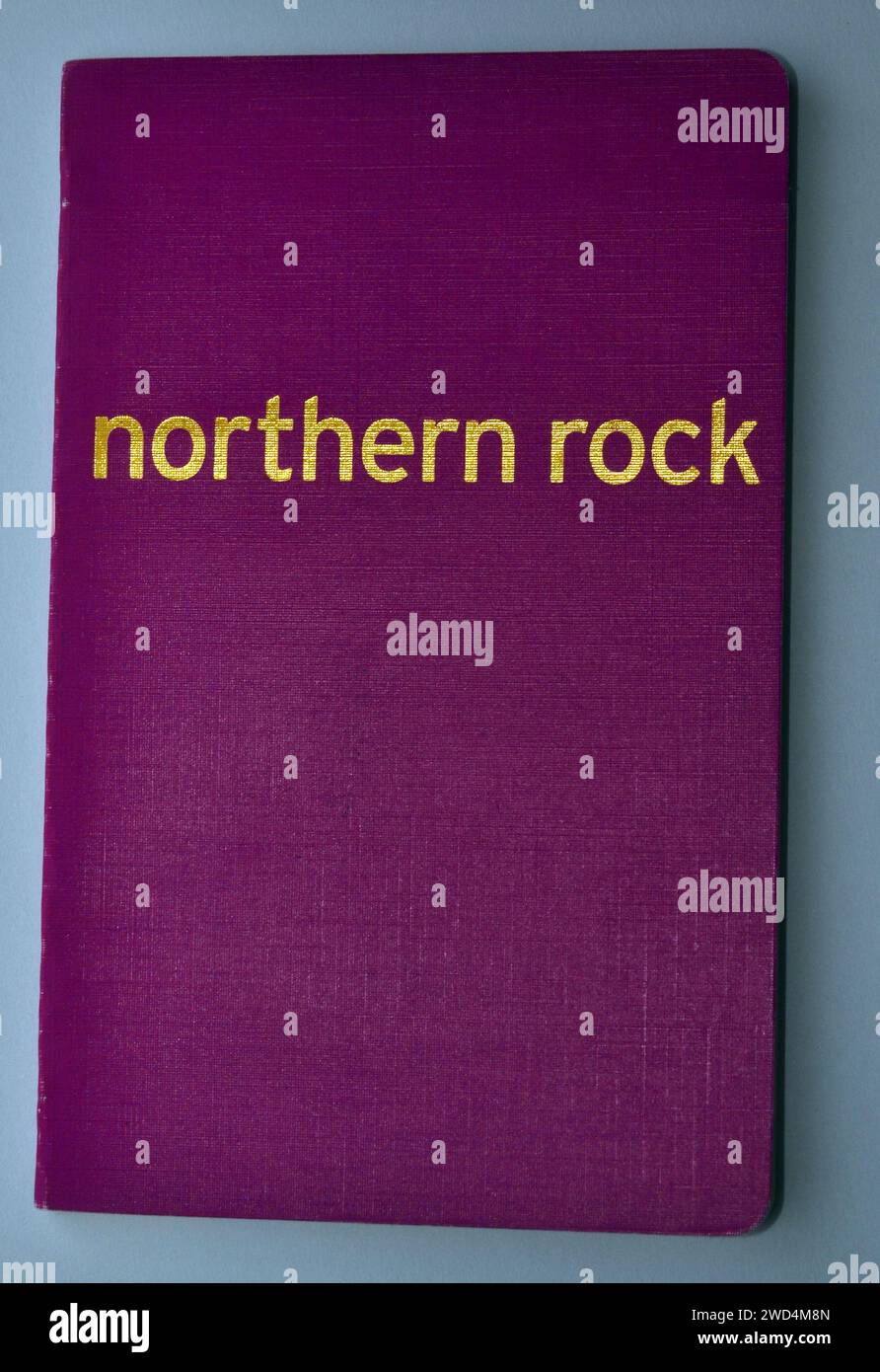 Cover of a Northern Rock bank savings book, gold text on a purple cover Stock Photo