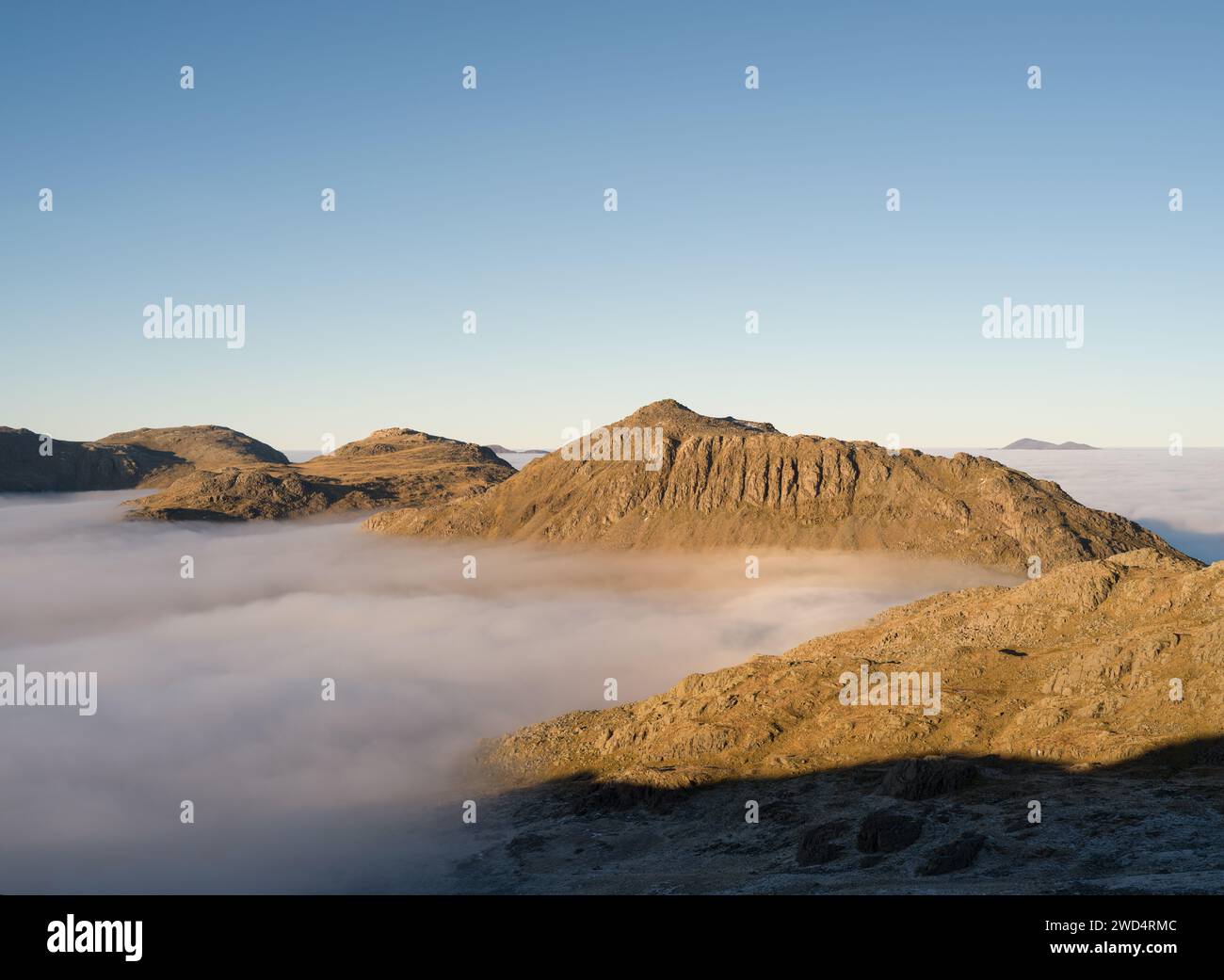 Bowfell, Esk Pike and Great End seen from Crinkle Crags during a cloud ...