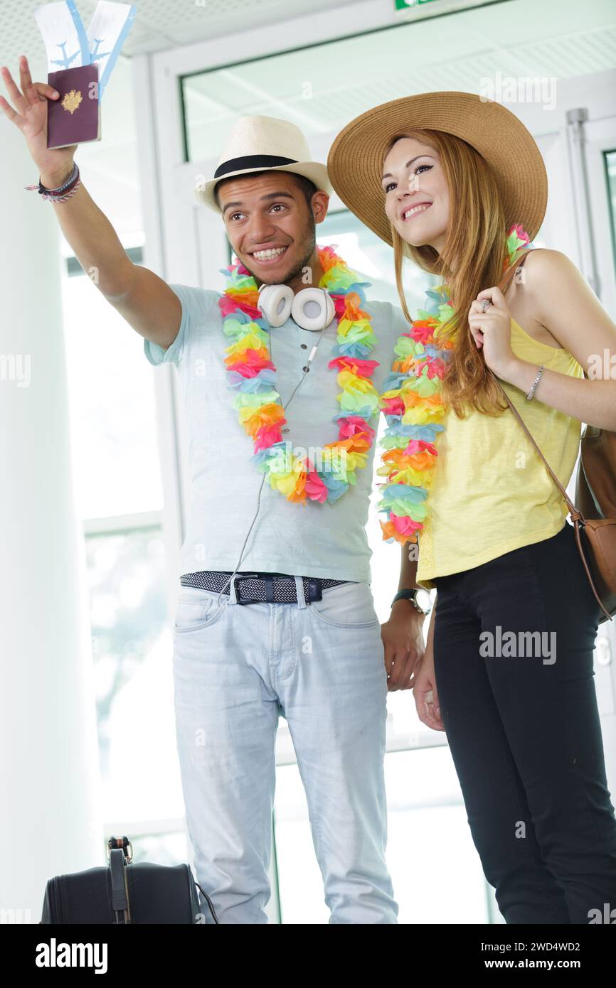 acouple say hi or goodbye for abroad at airport Stock Photo